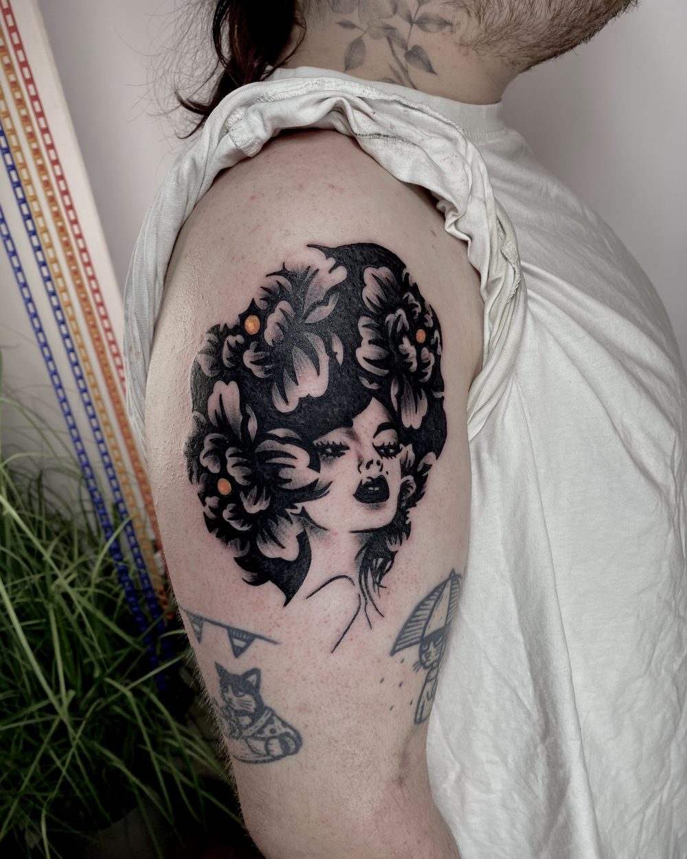 Butterfly and ornament centred on an upper back