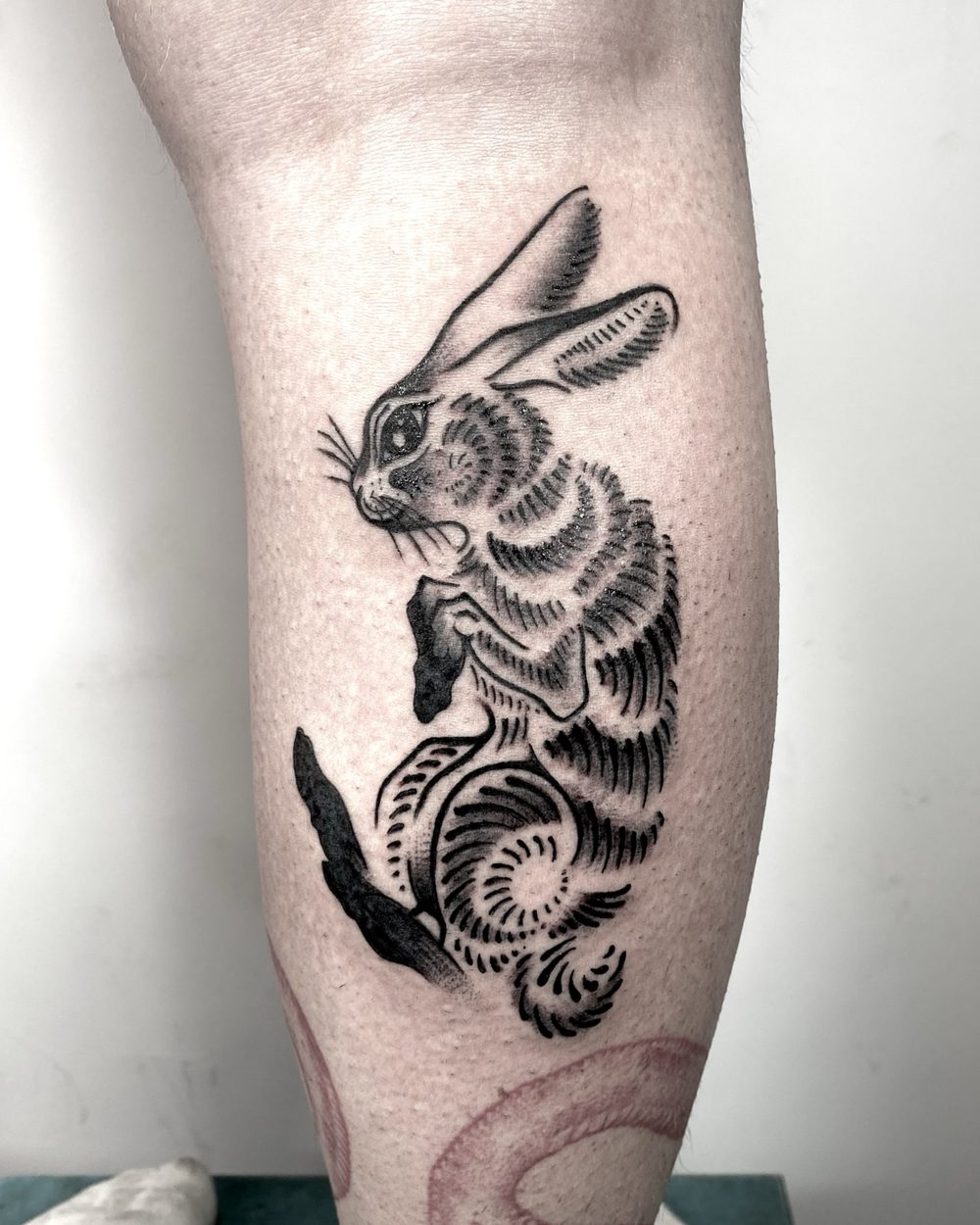 Bearded portrait in solid blackwork on an inner arm
