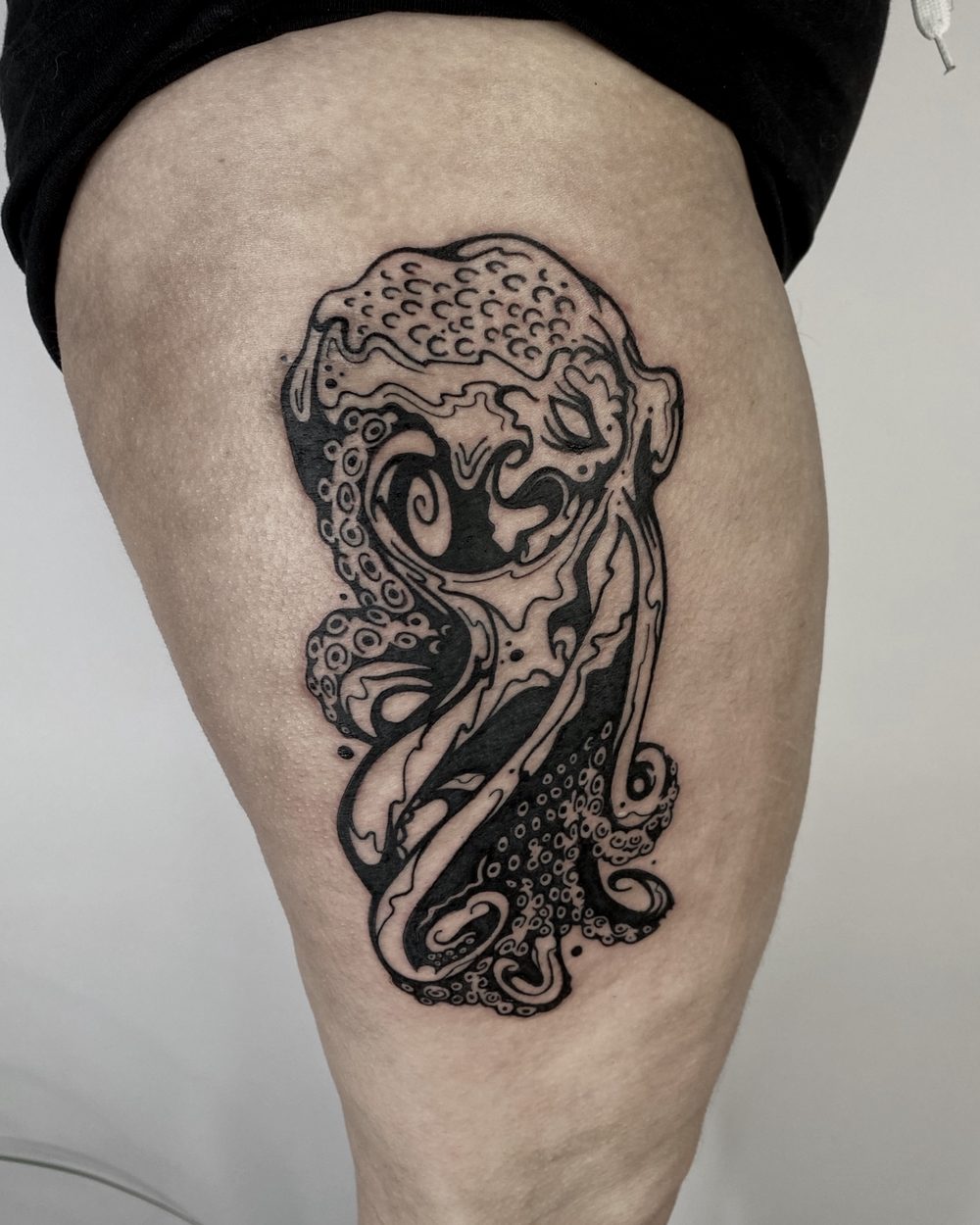 Brush-drawn heart with an ink drip on a calf
